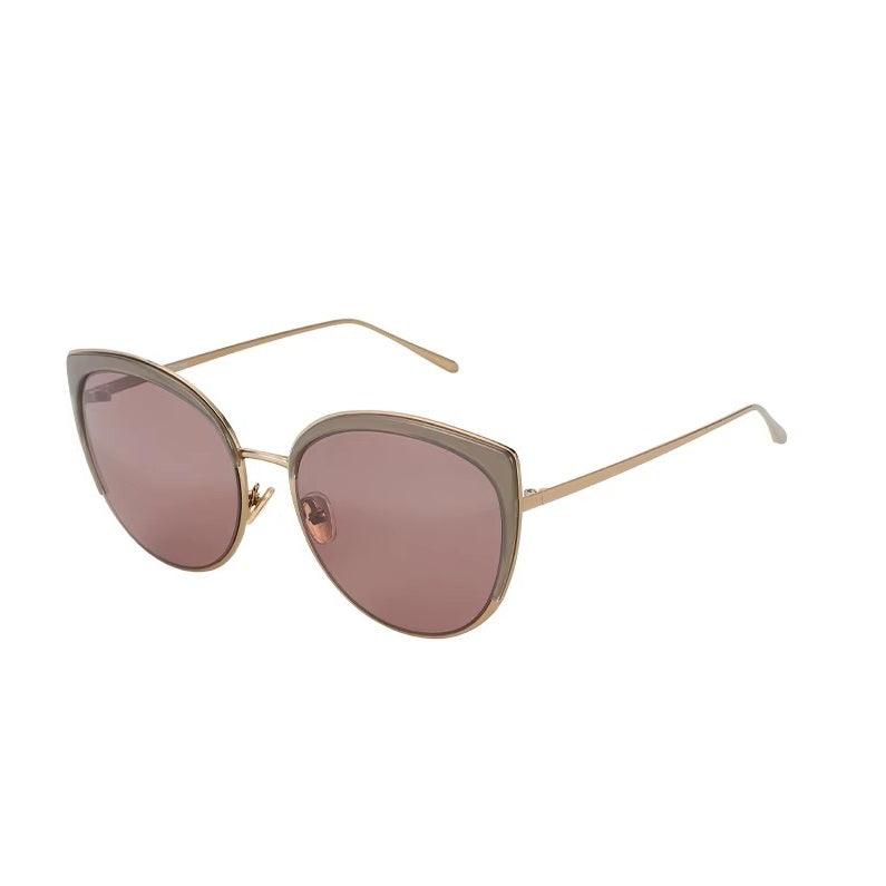 Zenottic Flora sunglasses: Cat-eye frame with gold accents and grey frame, gradient pink lenses.