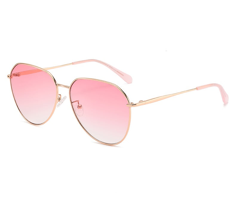 Zenottic Kerstin sunglasses with gold frame and pink gradient lenses, stylish aviator design